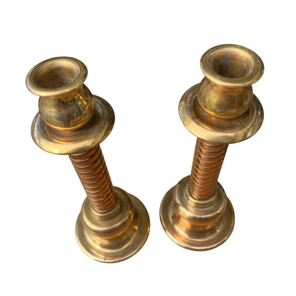 Close-up of spiral column stem on vintage brass candlestick showing stacked grooves