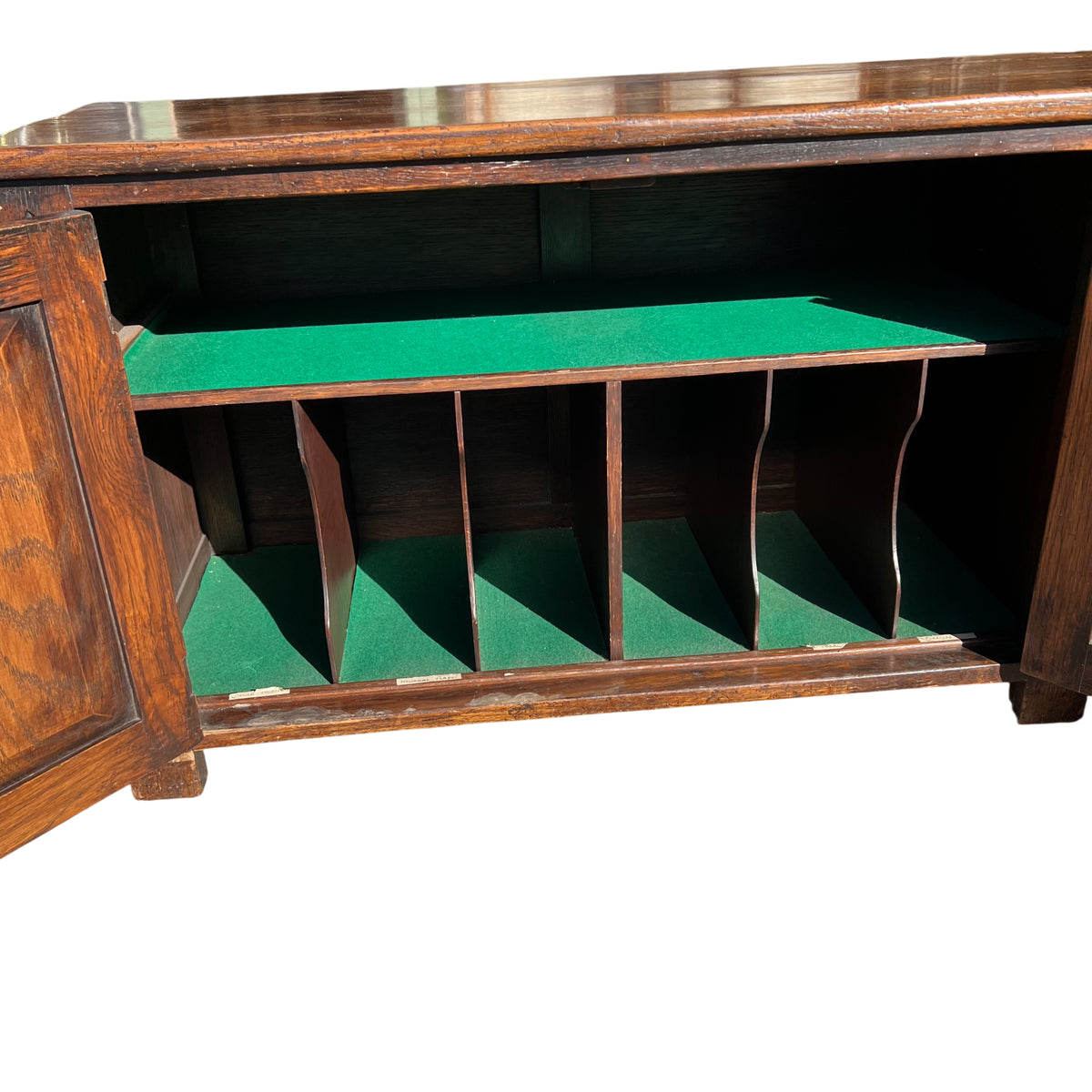 Front view of long oak sideboard with symmetrical carved tracery on doors