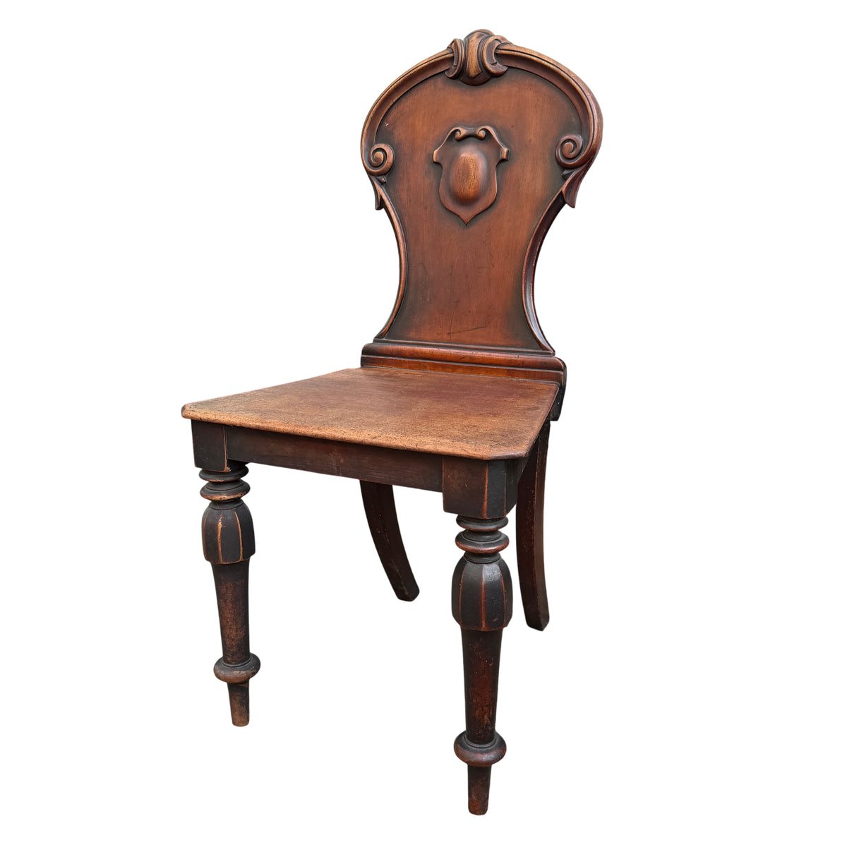 Victorian mahogany hall chair with carved shield back and turned front legs