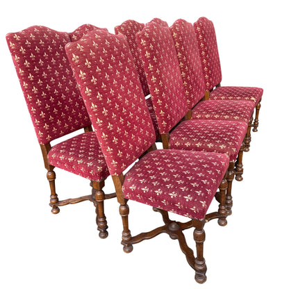 High back vintage dining chair with red patterned upholstery and wooden stretcher base