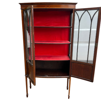 Close-up of leaded arched glass detail on inlaid mahogany display cabinet