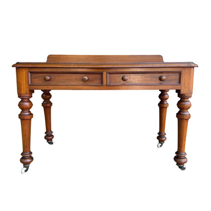 Front view of Victorian two-drawer console table with round wooden knobs