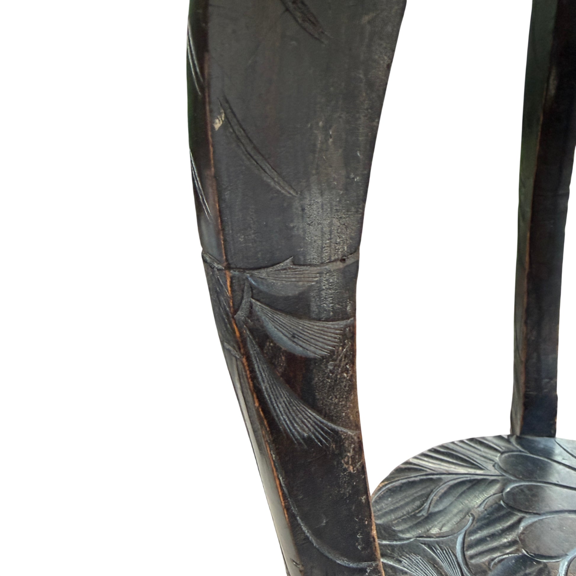 Lower shelf carved with matching floral motif on vintage side table
