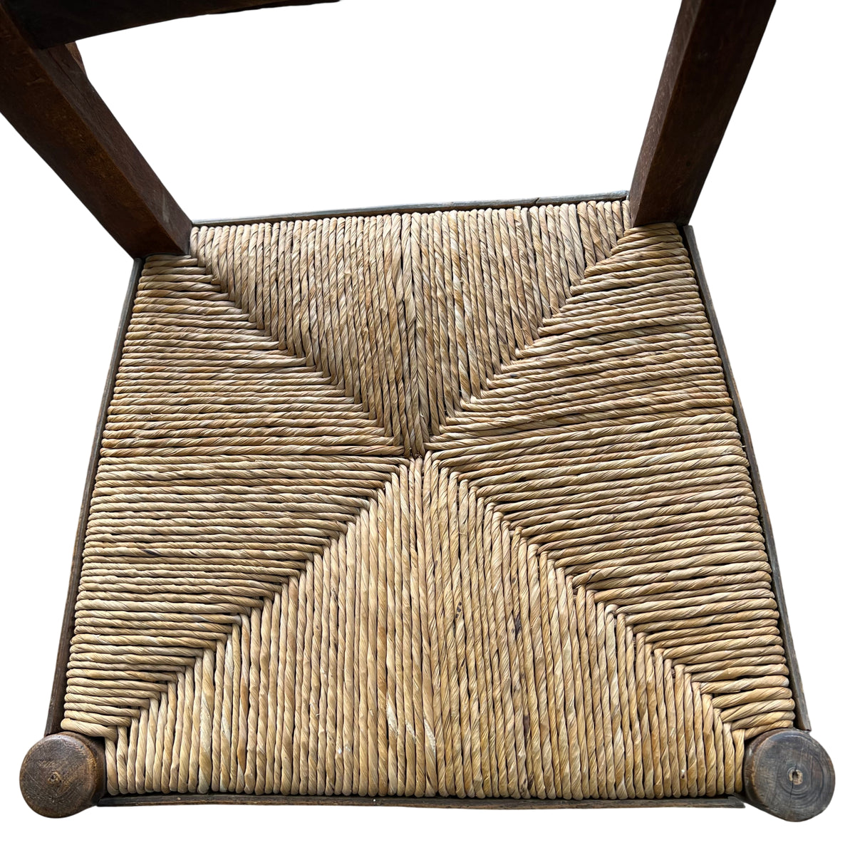 Side view of vintage solid wood dining chair and turned front leg
