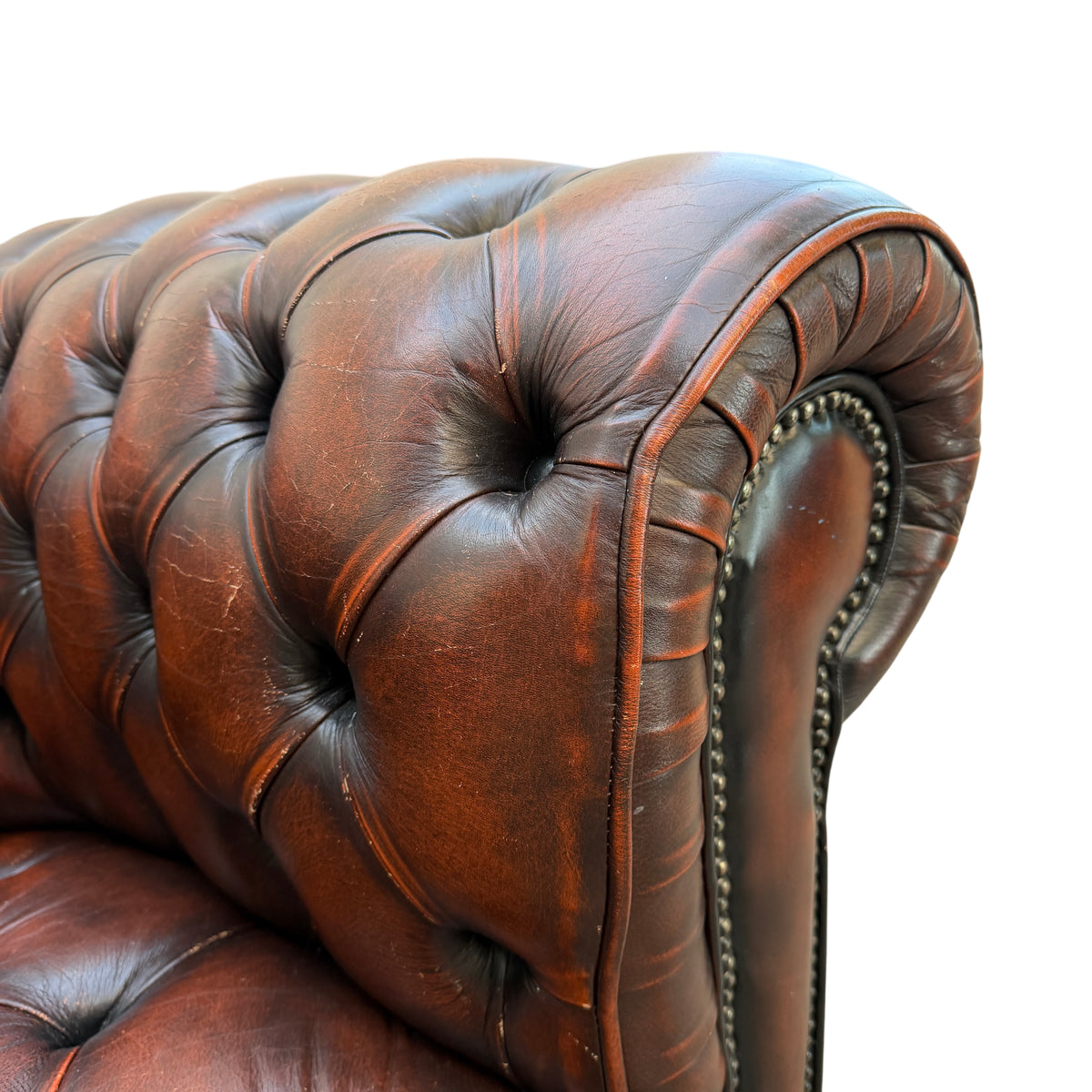 Close detail of deep button tufting and stitching on Chesterfield seat