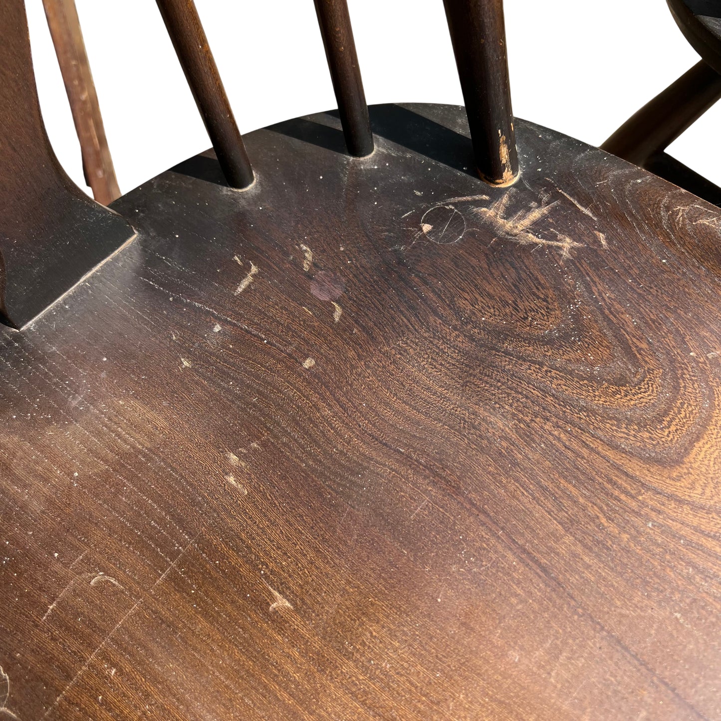Detail of central carved splat on Windsor-style chair back with three spindles