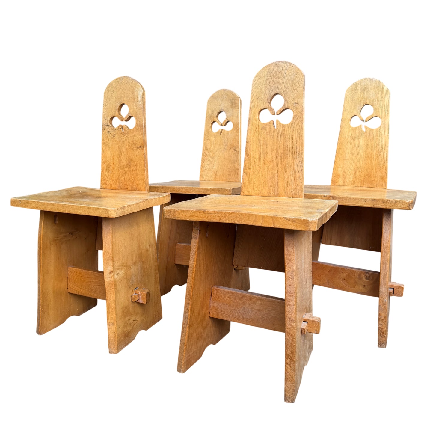 Set of four Arts & Crafts oak dining chairs with carved club-shaped cut-outs to the backs