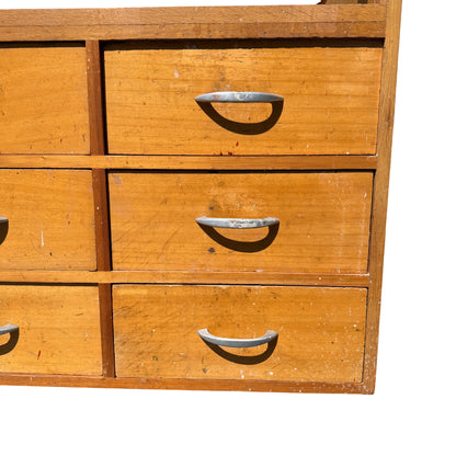 Top view of glazed glass display panel and fluorescent tube inside vintage counter