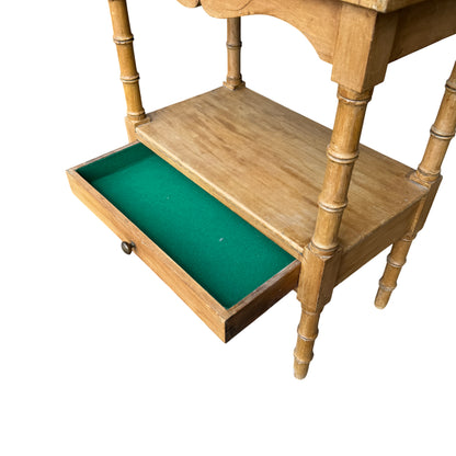 Lower shelf and turned supports of small pine side table storage cabinet