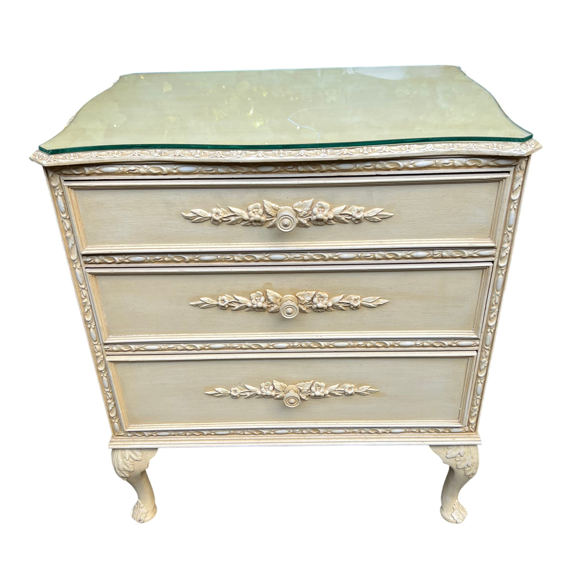 Vintage chest of drawers showing cabriole legs and carved pad feet
