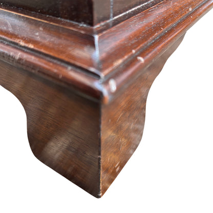 Close-up of drawer fronts showing grain and light surface scratches on veneer