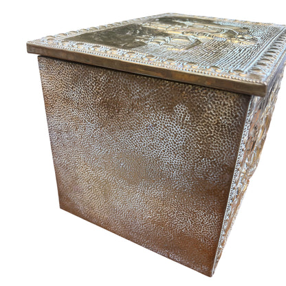 Side view of hammered brass texture on a vintage embossed storage box