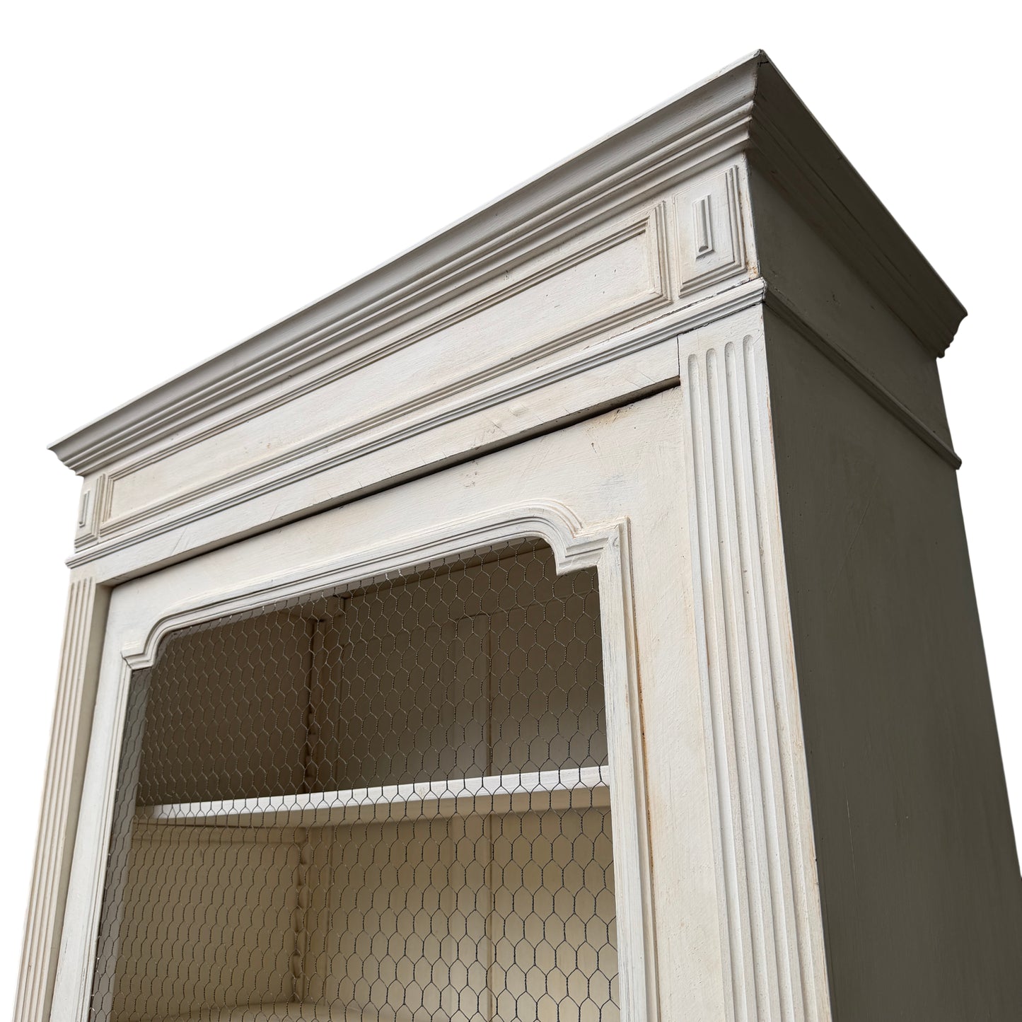 Detail of the painted cornice and fluted pilaster on a French painted armoire