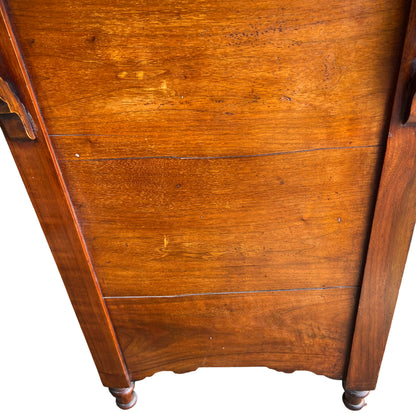 Detail of turned front leg with castor on antique oak chest