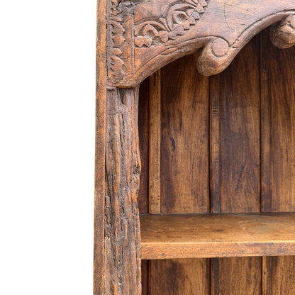 Side corbel and carved support detail on oak display bookcase
