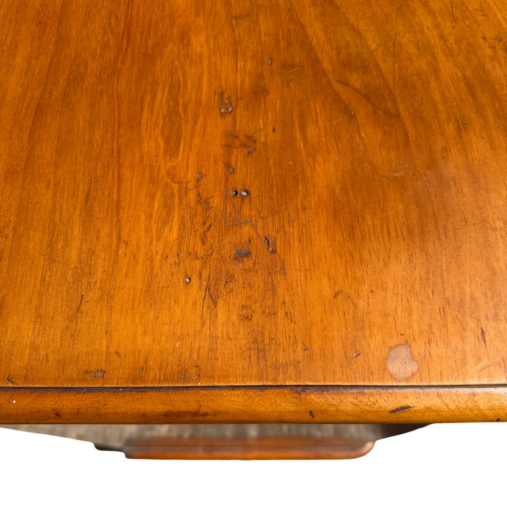 Detail of moulded top edge and pine grain on Victorian chest of drawers