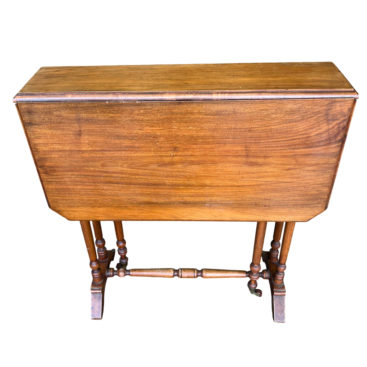 Folded tilt-top oak occasional table showing narrow profile and moulded edge