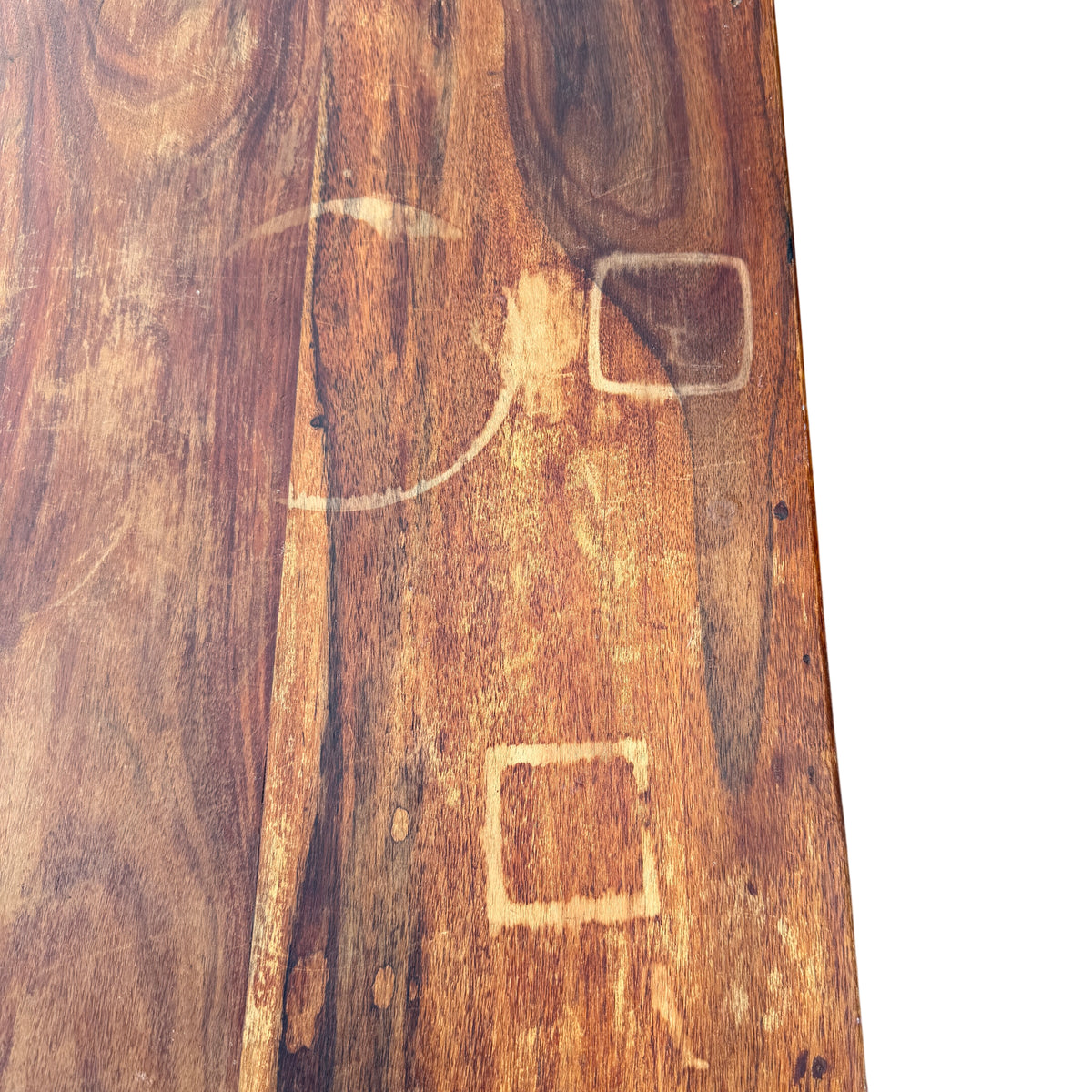 Base and plinth of solid wood six-drawer chest showing scuffs and wear