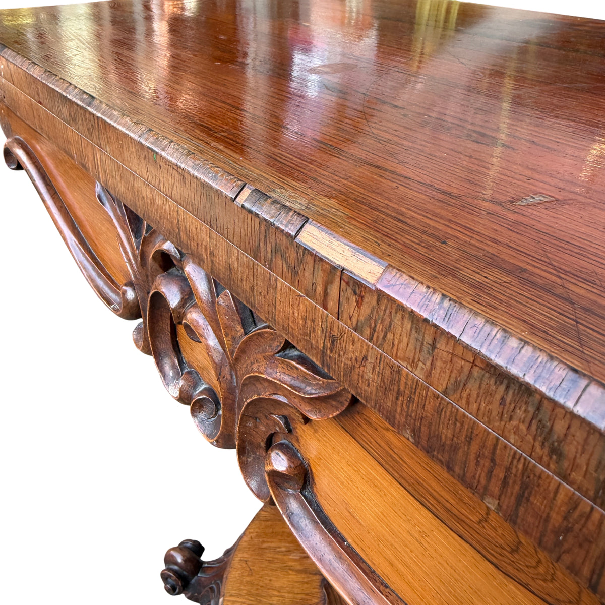 Carved apron detail on Victorian walnut occasional table