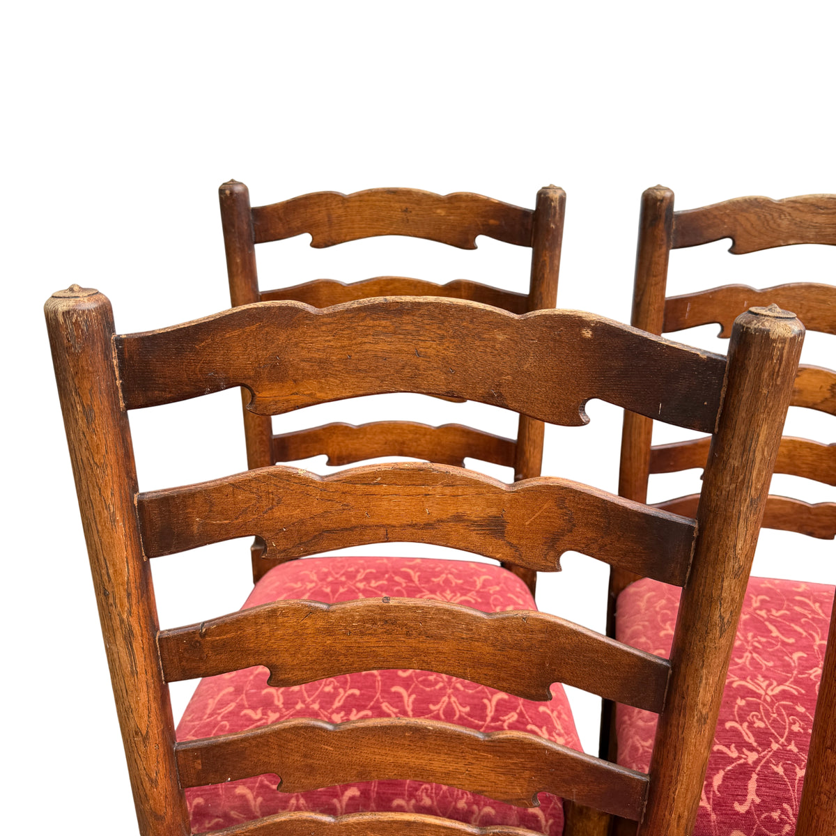 Side view of ladderback dining chair showing three slatted back and arm support