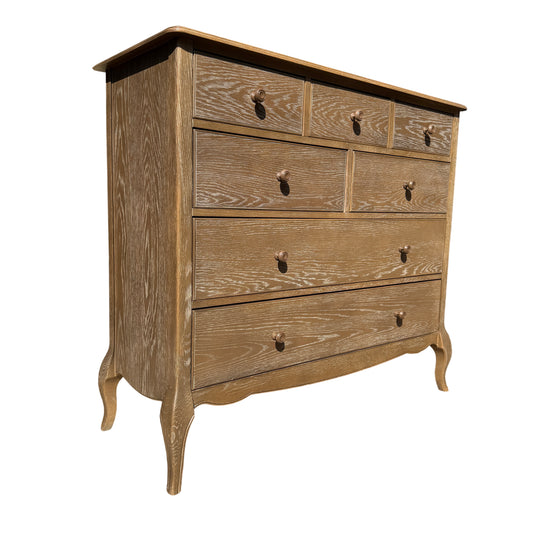 Contemporary oak-effect five-drawer chest of drawers with whitewashed grain finish and round knobs