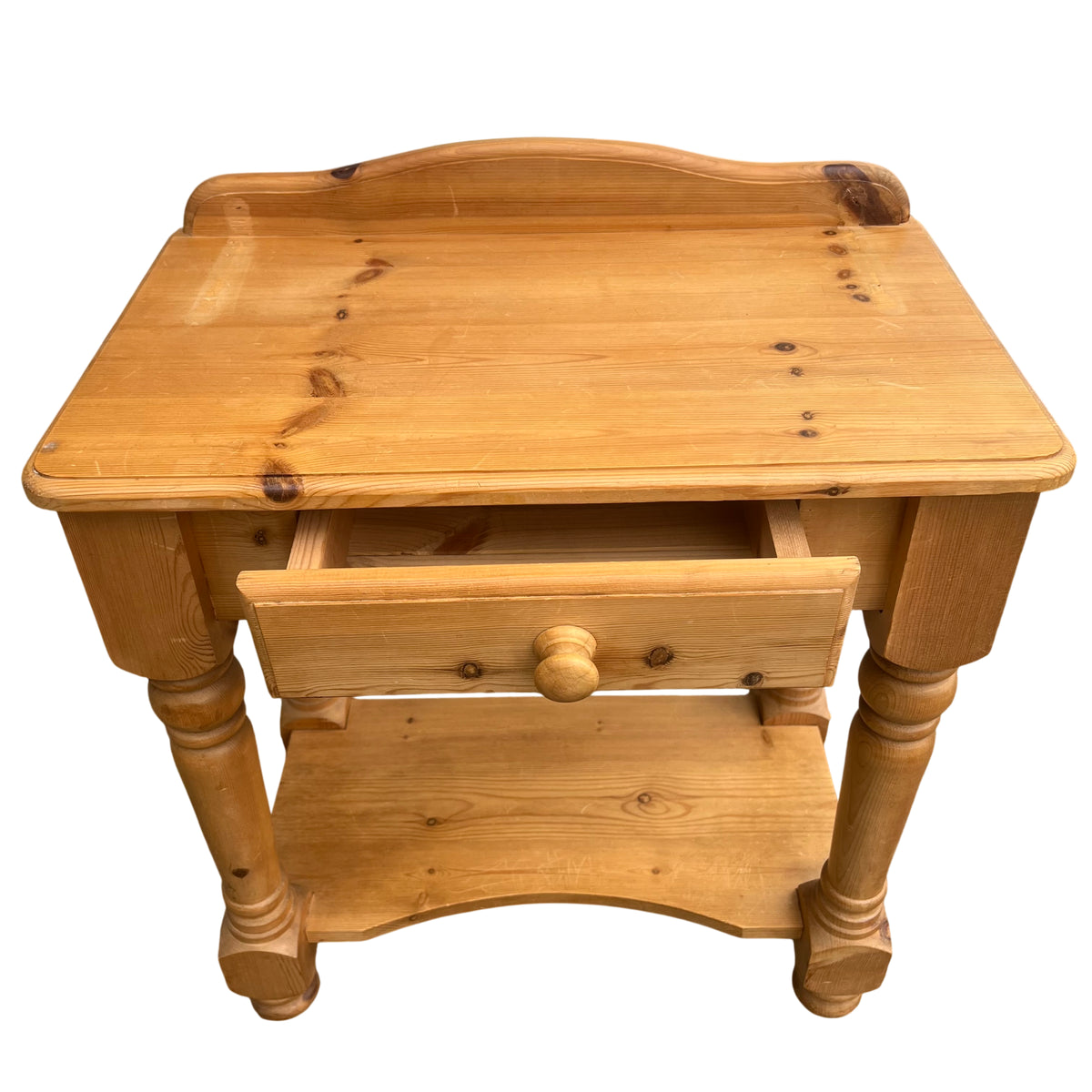 Detail of turned leg and lower shelf of vintage pine hall table