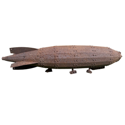 Perforated ventilation panels and square cutouts along the side of the pressed-steel airship model