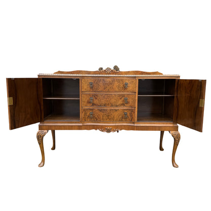 Full width view of vintage burr walnut sideboard in outdoor setting