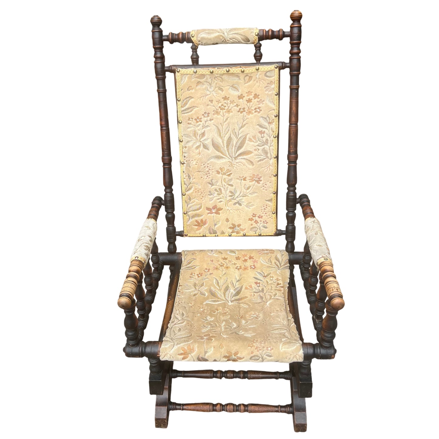 Close-up of floral tapestry upholstery on Victorian rocking chair backrest