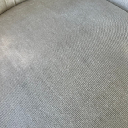 Shaped wood armrail and trim on upholstered Victorian armchair