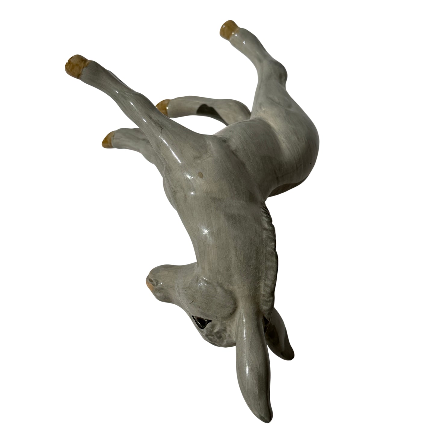 Full body view of the grey glazed Wedgwood donkey foal figurine standing on four legs