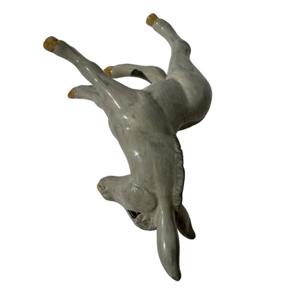Full body view of the grey glazed Wedgwood donkey foal figurine standing on four legs