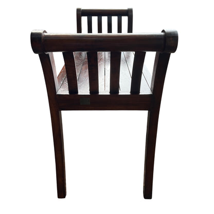Close-up of scroll-ended arm and slatted seat on Lombok teak bench