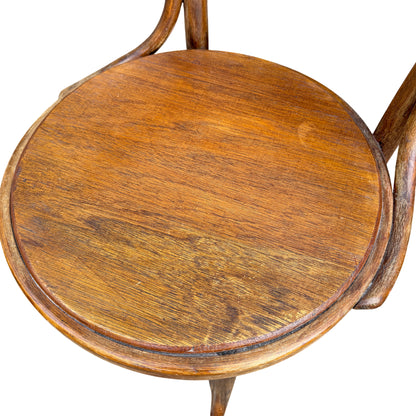 Round wooden seat of a vintage bentwood dining chair