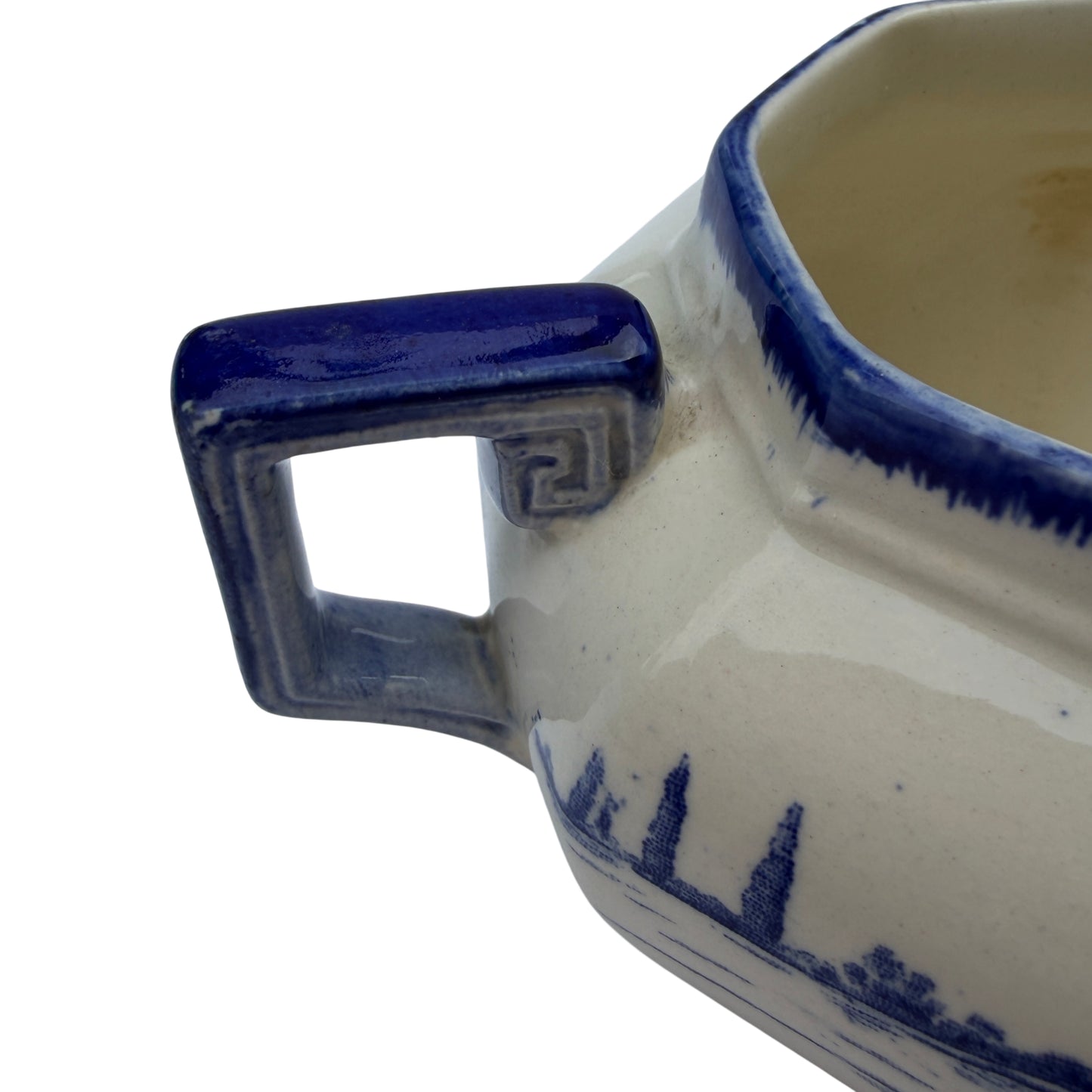 Close up of geometric handle and blue glazed detail on transferware jug