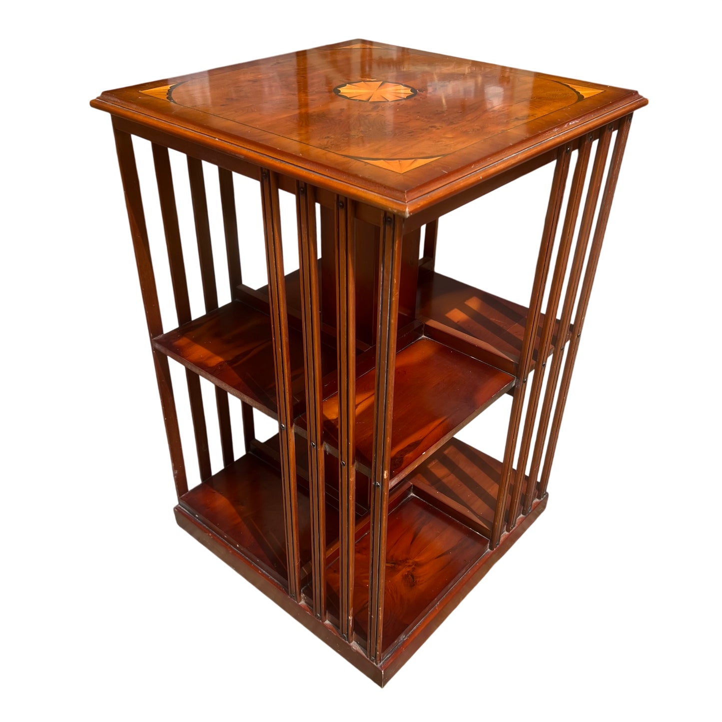 Vintage revolving bookcase in mahogany veneer with inlaid marquetry top and tiered shelving