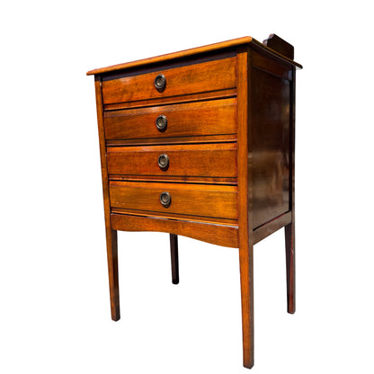 Top view of sheet music cabinet showing raised gallery and polished surface