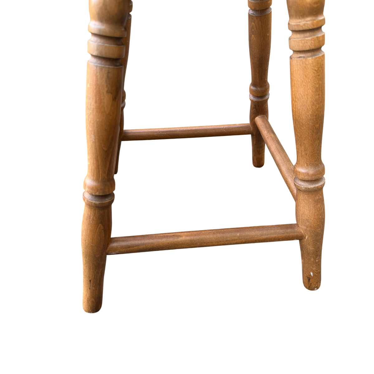 Three-quarter view of compact wooden stool suitable as occasional table