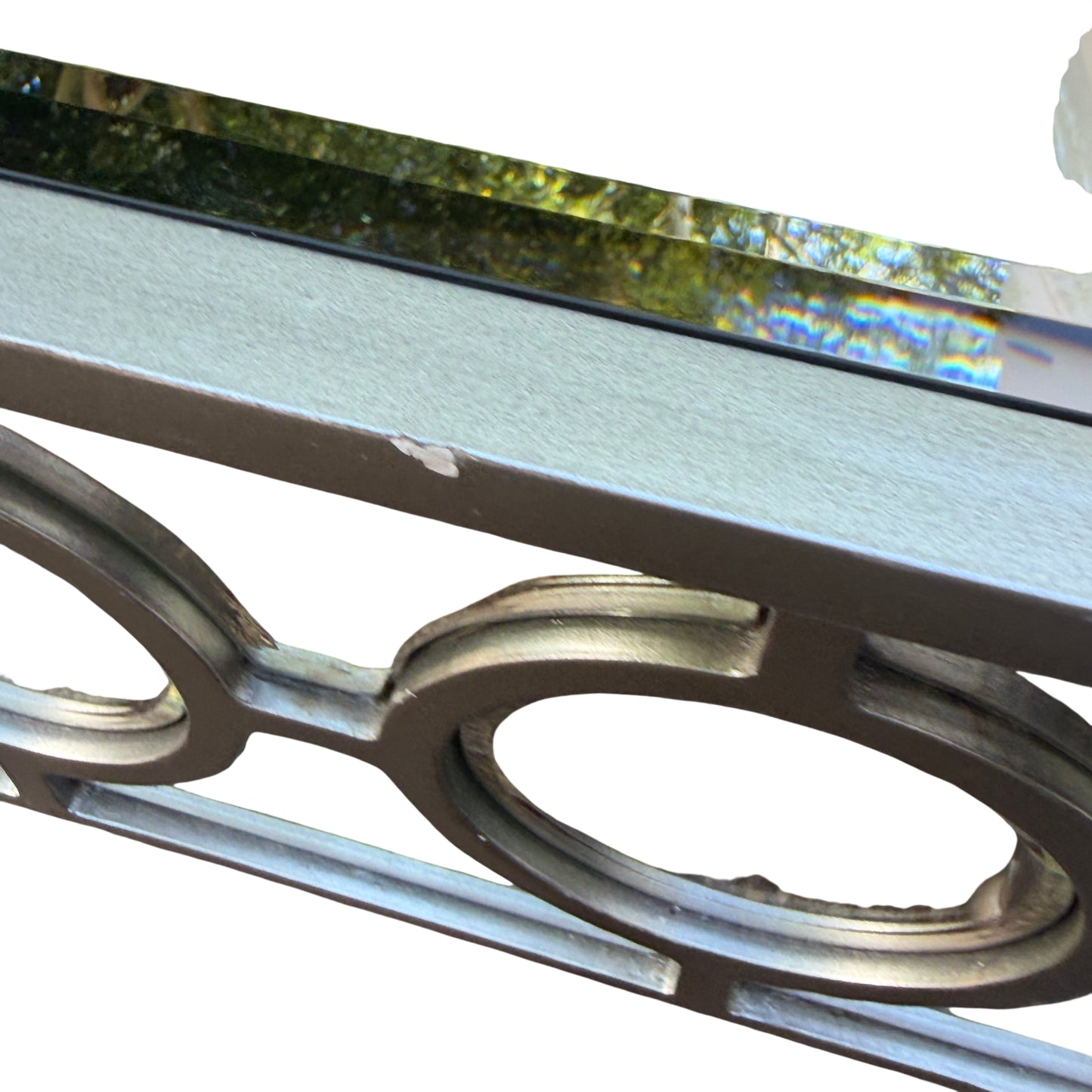 Front view of mirrored side table with rectangular glass top and mirrored panels