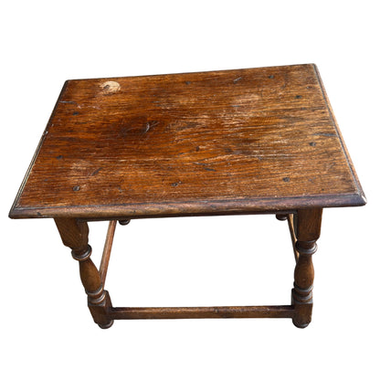 Small vintage occasional table in oak with long stretcher and turned supports