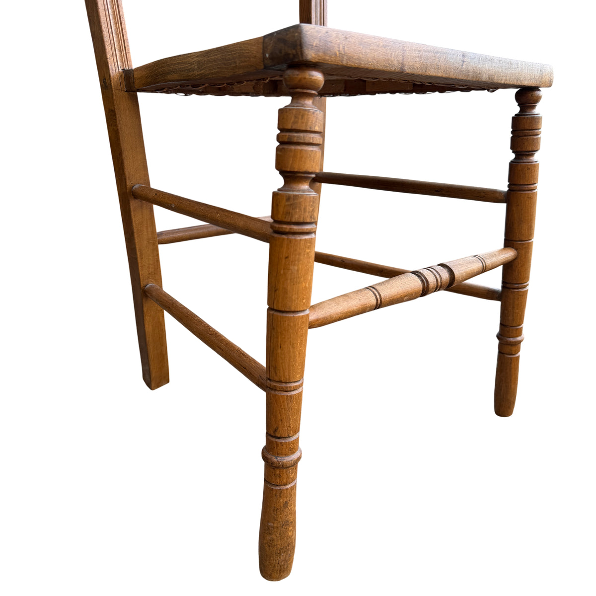 Worn finish and small surface scratches on wooden dining chair frame