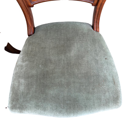 Pair of Victorian dining chairs with mahogany frames and green upholstery