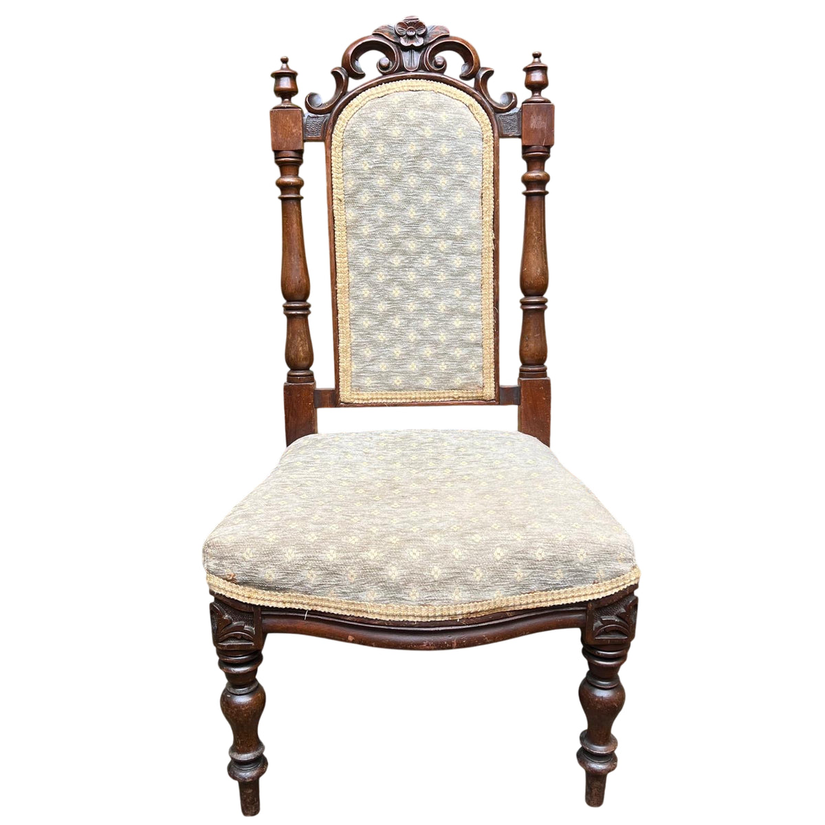 Victorian carved upholstered dining chair with floral crest and turned front legs