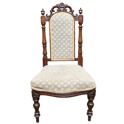 Victorian carved upholstered dining chair with floral crest and turned front legs