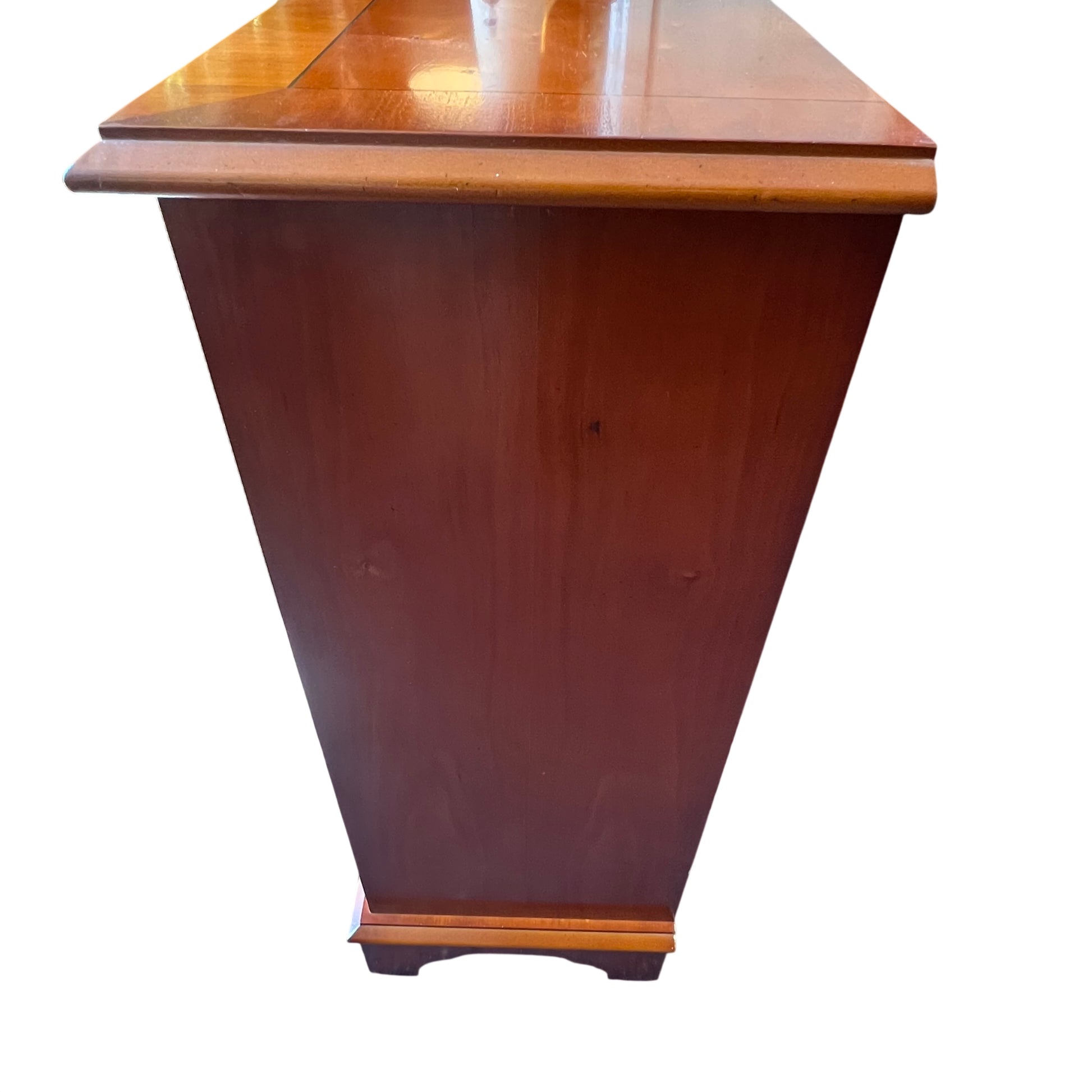 Detail of brass style drop handles on small pine bookcase drawers
