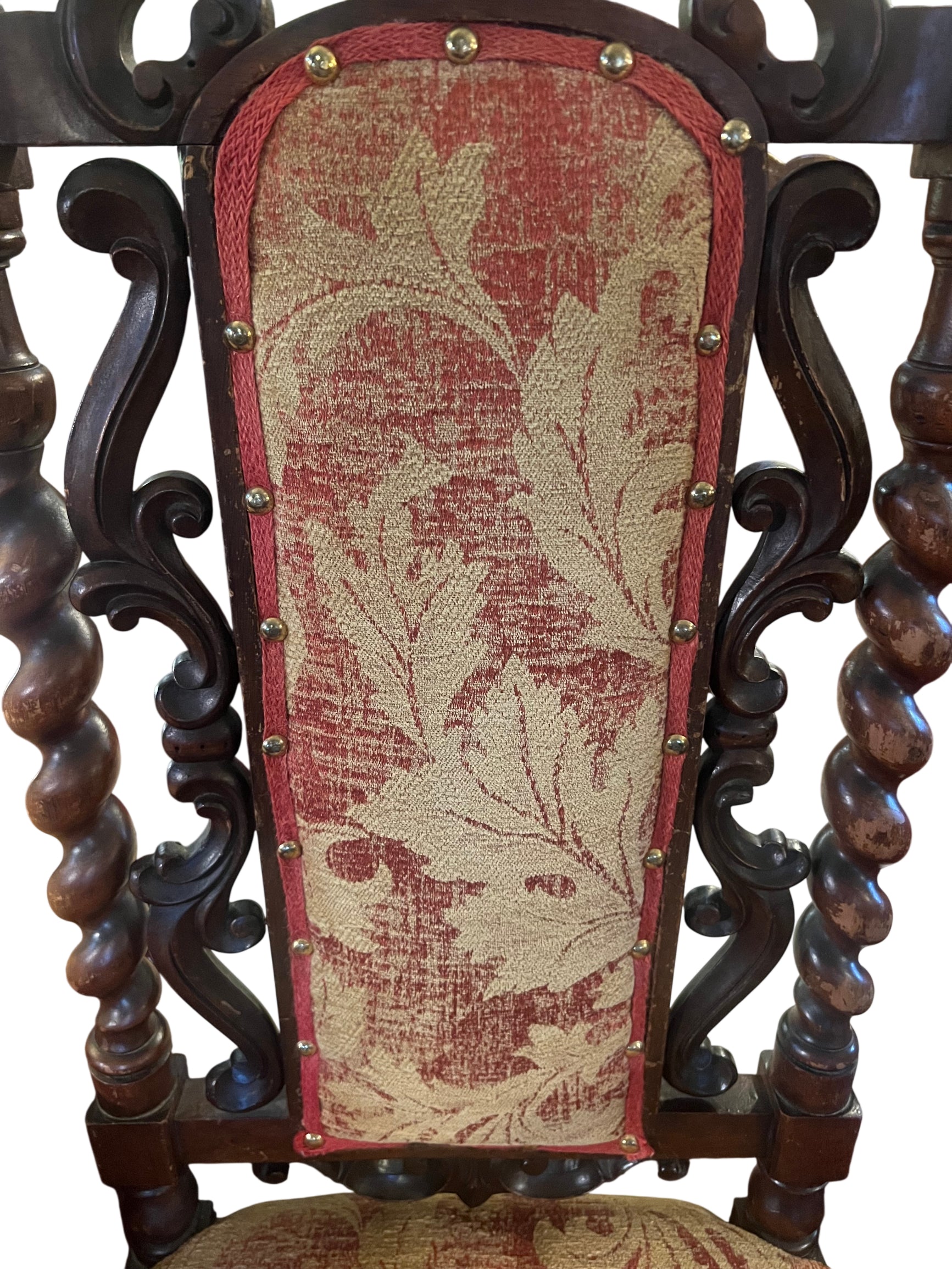 Lower frame detail with carved apron and turned legs on antique walnut chair