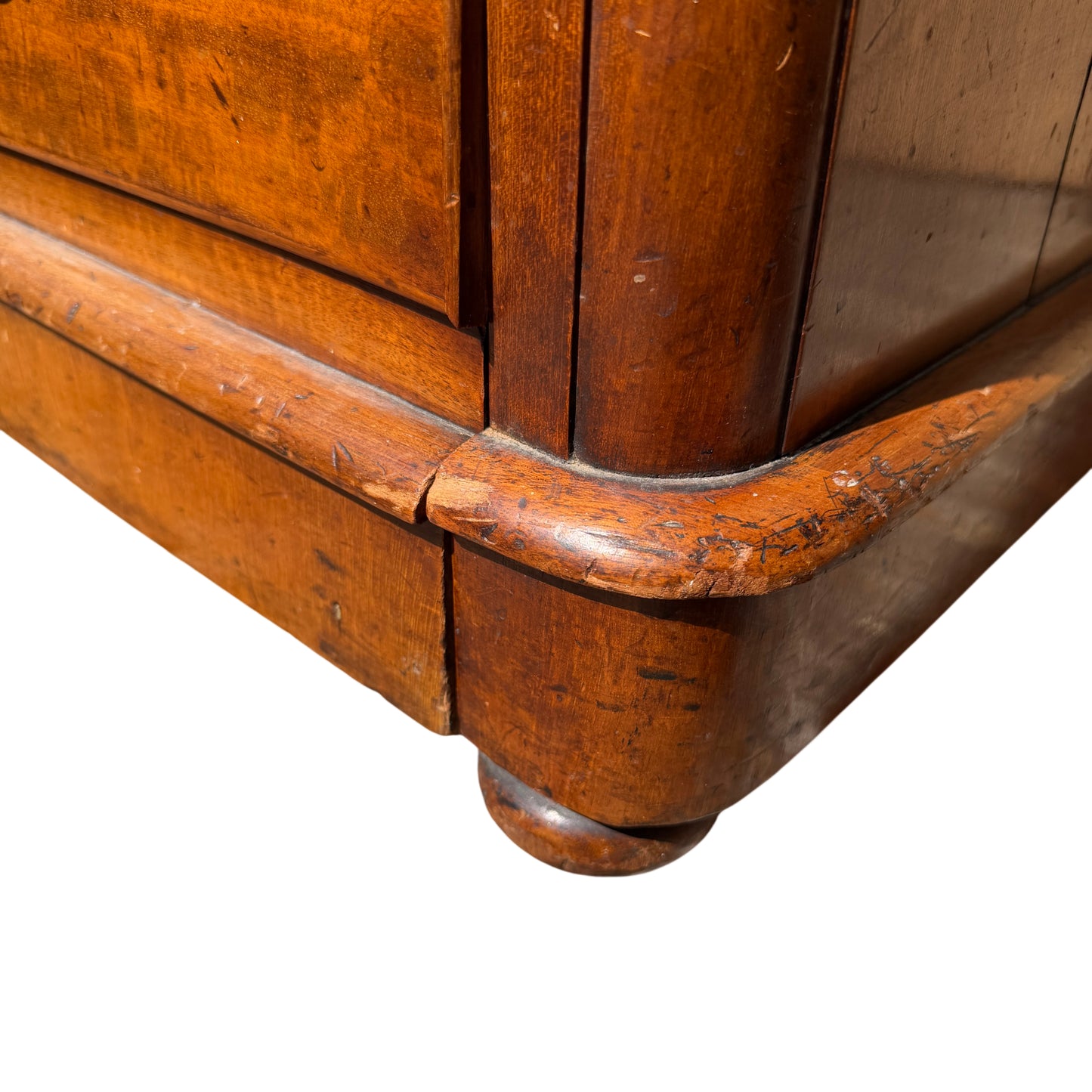 Angle view of four-drawer pine chest with warm honey finish