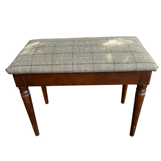 Vintage tweed-upholstered bench with green checked fabric and turned wooden legs