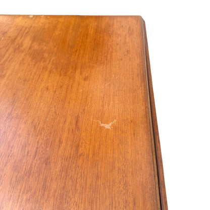 Table with drop leaves lowered showing slim profile and turned legs