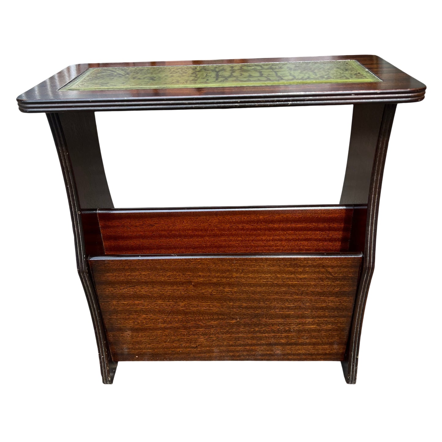 Top view showing green tooled leather panel and mahogany finish on a music cabinet